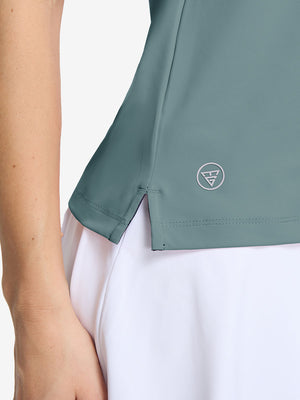 Detail view of hem on dusty blue women's collared v neck quick dry tank tops