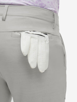 Detail view of back pocket on light gray straight fit lightweight dress golf pants