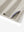 Detail view of hem on oyster gray dry fit waffle textured collared golf shirts