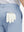 Detail view of back pocket on sky blue stretch cotton blend slim fit golf trousers 5 pockets