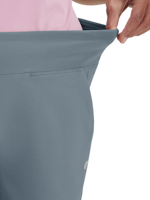 Detail view of waist stretch on grey blue women's high waist stretch golf pants with pockets