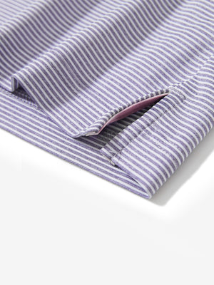 Detail view of hem on light purple white comfy breathable pin-stripe texture golf polos