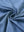 Close-up fabric detail of skin-friendly long sleeve melange polo, soft blend texture with blue heather tone