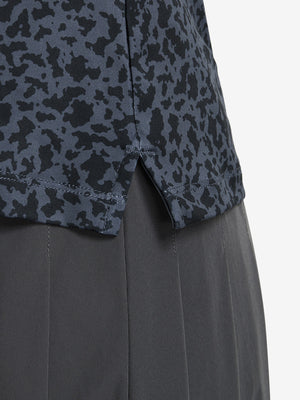Detail view of hem on black gray blocks women's sleeveless q-zip print quick dry golf tops