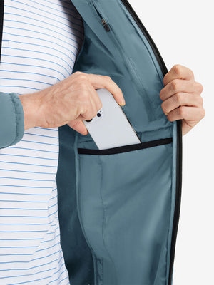 Detail view of inner pocket on slate blue warm puffer winter golf jacket