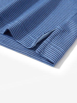 Detail view of hem on light blue navy comfy breathable pin-stripe texture golf polos