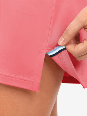 Hem stitching detail close-up in lavender of women's lightweight golf dress with 2 pockets.