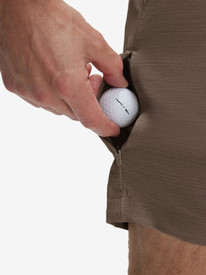 Detail view of stretch fabric on tobacco brown flat front hybrid golf shorts