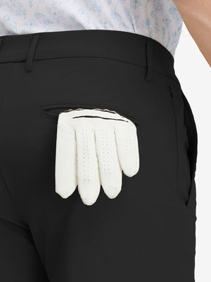 Detail view of back pocket on black stretch cotton blend slim fit golf trousers 5 pockets