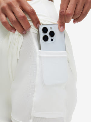 Inside view of pocket on white women's high waist 2 in 1 quick dry shorts with 7 pockets