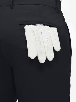 Detail view of back pocket on black flat front flex cotton blend golf shorts