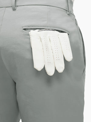Detail view of back pocket on rose dust flat front flex cotton blend golf shorts