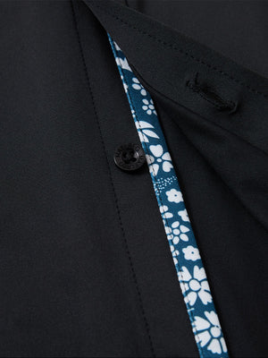 Detail view of buttons on black cool print plain button up shirts