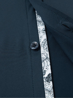 Detail view of buttons on navy cool print plain button up shirts