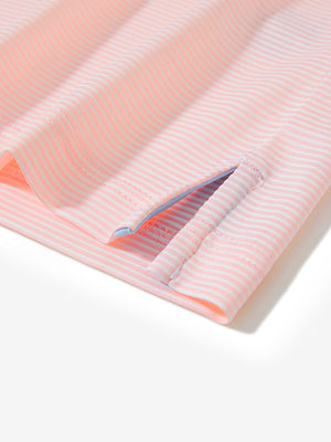 Detail view of hem on light pink white comfy breathable pin-stripe texture golf polos