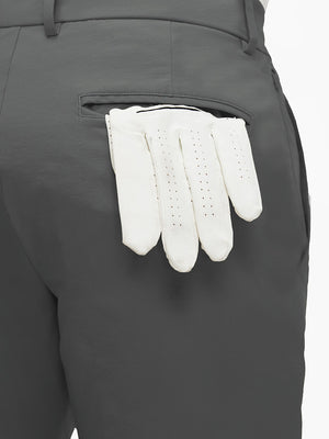 Detail view of back pocket on dark grey flat front flex cotton blend golf shorts