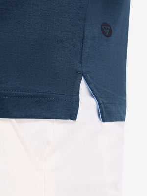 Hem detail close-up in dark blue heather of performance heather contrast collar polo shirts.