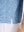 Detail view of hem on blue white abstract maze premium ribbed collar print polo shirts