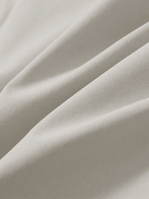 Close-up of light khaki stretch quick dry casual golf pants with 4 pockets fabric texture.