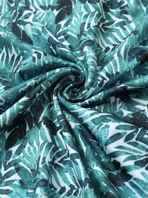 Fabric detail of Stylish print boys polo shirts with soft feel and dark green leaf pattern