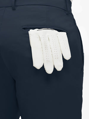 Detail view of back pocket on navy flat front flex cotton blend golf shorts