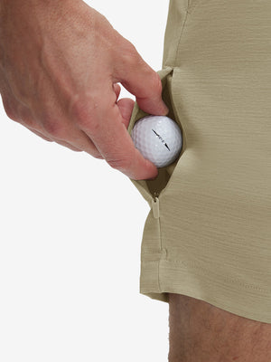 Detail view of stretch fabric on khaki flat front hybrid golf shorts