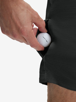 Detail view of stretch fabric on dark charcoal flat front hybrid golf shorts