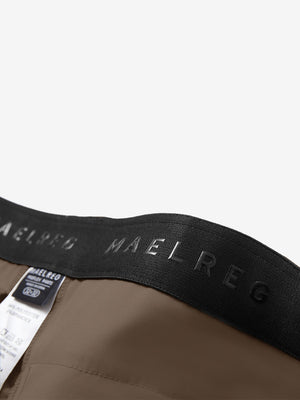 Detail view of inner waistband on tobacco brown straight fit lightweight dress golf pants