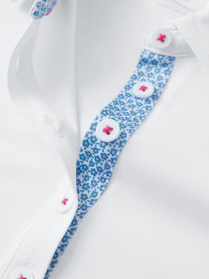 Detail view of collar and buttons on white women's 5 buttons collared polo shirts