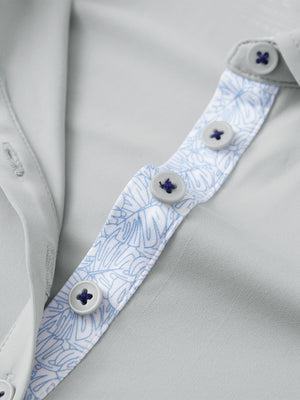 Detail view of collar and buttons on light grey women's 5 buttons collared polo shirts