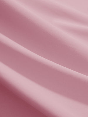 Close-up texture of lavender women's 4 buttons golf polo shirts fabric showing detailed knit weave.