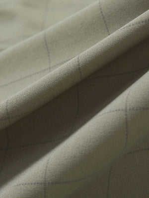 Close-up texture of birch grey grid performance reflective checked collar golf shirt fabric showing weave detail.