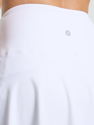 Detail view of back design on white women's high waisted golf skirts with 4 inner pockets