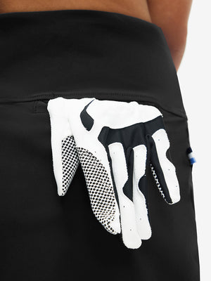 Back view of pocket on black high waist built-in short a-line golf skirt with 5 pockets