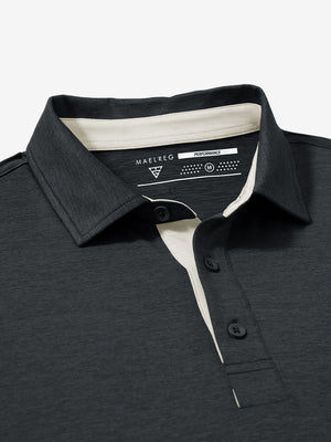 Collar and button detail close-up in black heather of performance heather contrast collar polo shirts.
