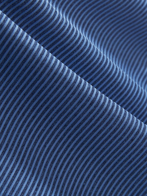 Close-up texture of light blue navy comfy breathable pin-stripe texture golf polos fabric showing weave detail.