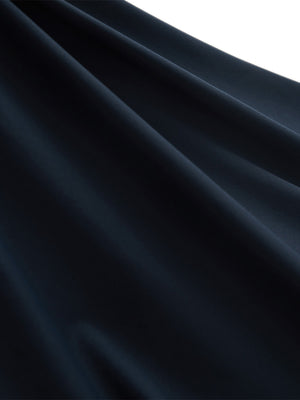 Close-up texture of navy blue women's moisture-wicking mock neck sleeveless golf tops fabric showing breathable weave detail.