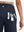Back side view of pocket on navy women's high waist 2 in 1 quick dry shorts with 7 pockets