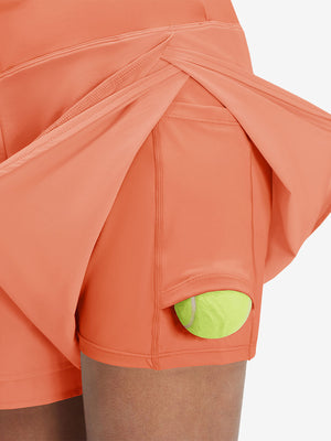 Detail view of side inner pocket on peach pink women's gym golf shorts with liner pocket