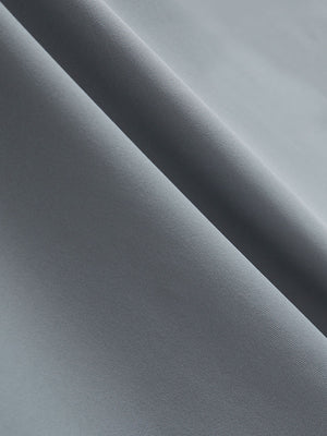 Close-up texture of grey cool print plain button up shirts fabric showing detailed print and weave.