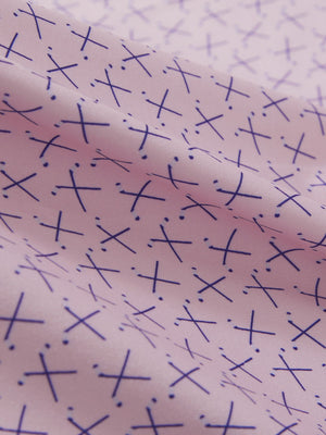 Close-up texture of pink golf club premium ribbed collar print polo shirts fabric showing detailed premium material and weave.