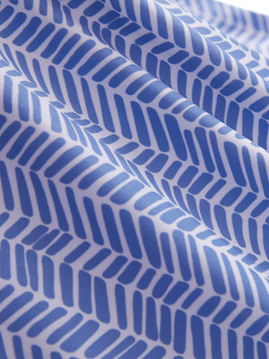 Close-up texture of white blue stripes women's sleeveless q-zip print quick dry golf tops fabric showing detailed print and quick dry weave.