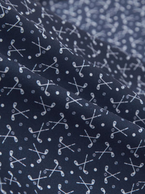 Close-up texture of dark blue golf premium ribbed collar print polo shirts fabric showing detailed premium material and weave.