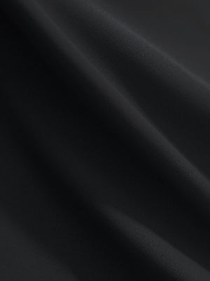 Close-up texture of black women's 4 buttons golf polo shirts fabric showing detailed knit weave.