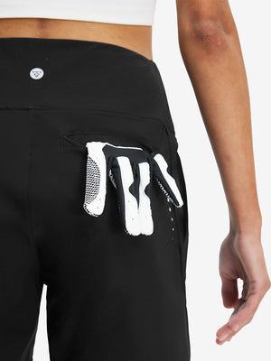 Back side view of pocket on black women's high waist 2 in 1 quick dry shorts with 7 pockets
