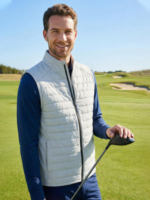 Lightweight Water-Resistant Puffer Vest, Light Grey Heather (Model Wearing The Vest Outdoors)
