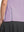 Detail view of hem design on pinkish purple women's breathable 1/4 zip pullover golf shirts