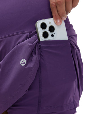 Detail view of inner pocket on dark purple women's stretch a-line golf skort with 7 pockets