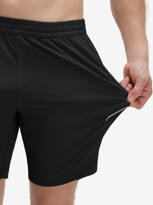 View showing loose fit of black 4 way stretch breathable workout athletic shorts
