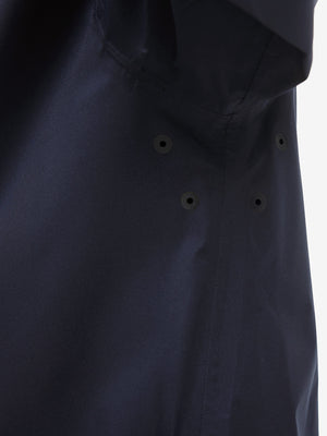 Detail view of underarm on navy waterproof lightweight rain jacket with hood